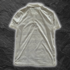 streetcave.eu Burberry Black Label Poloshirt in Weiß mit dezentem, dunklem Karomuster und klassischem Kragen