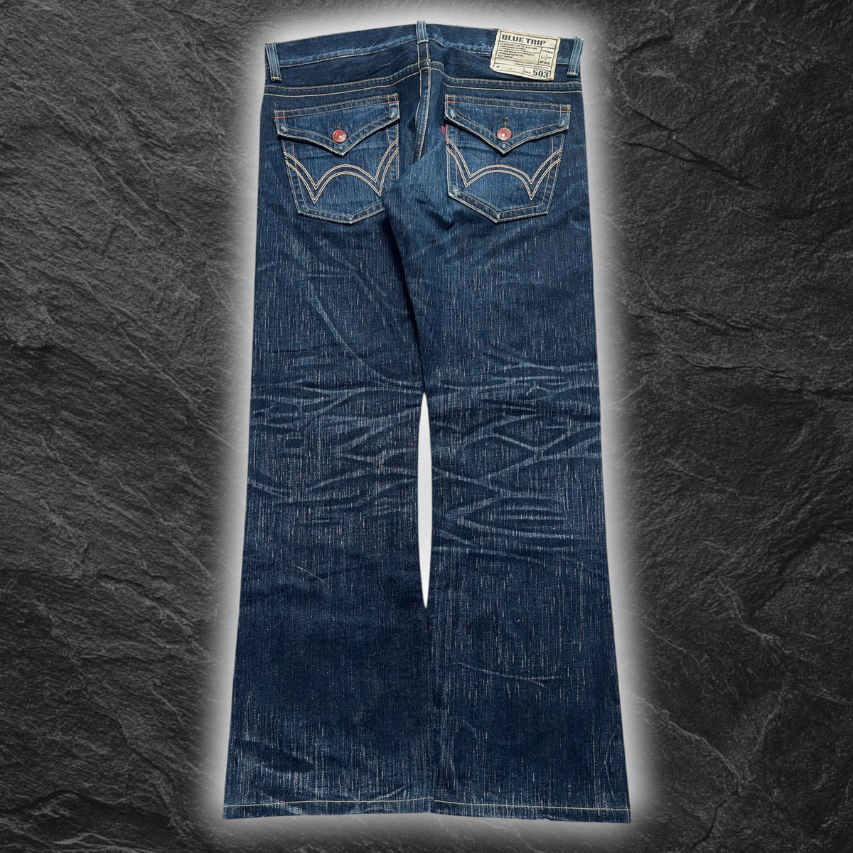 streetcave.eu Edwin Blue Trip 503 Flare Jeans in dunkelblauem Denim mit Whisker-Effekten und Gesäßtaschen mit Klappen