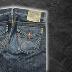 streetcave.eu EDWIN Blue Trip 503 Flare Jeans aus blauem Denim mit Gesäßtaschen mit Klappen und rotem Knopfdetail